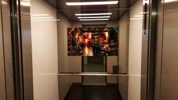Elevator LCD Screens Behind Mirror